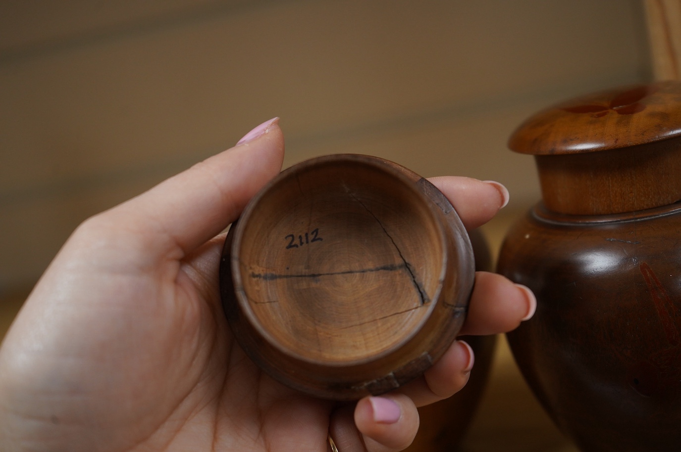 A pair of 18th century lacquered pear wood tea caddies, as seen in Pinto's book, page 293 and plate 315 (D), 12.5cm tall. Condition - repairs to covers, some wear to lacquer